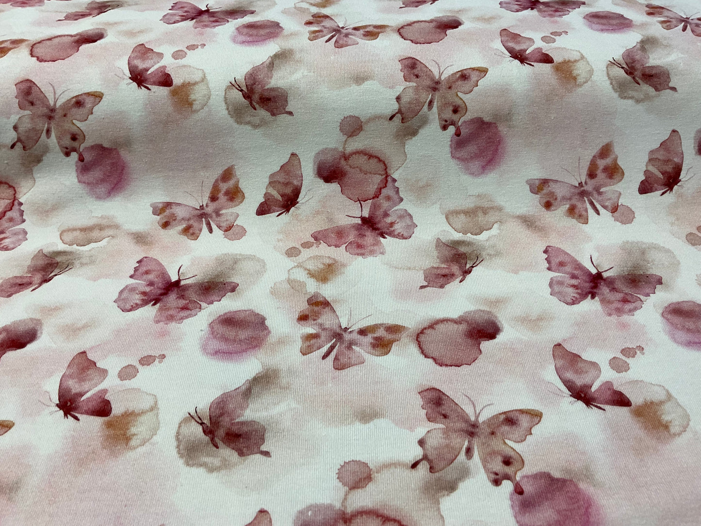Baumwolljersey Schmetterlinge auf rosa Aquarell 20 cm