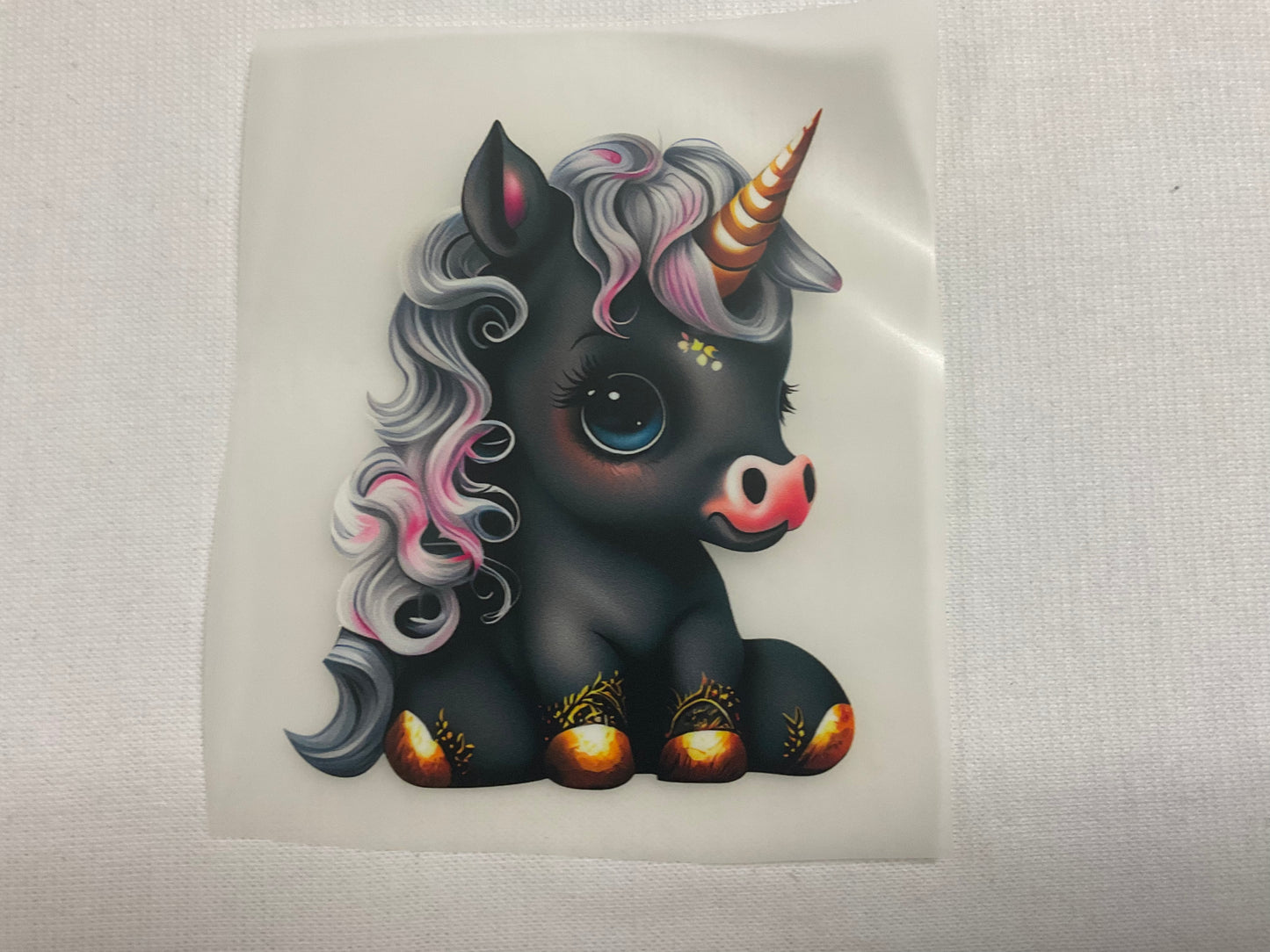 Bügelbild sitzendes Einhorn Schwarz, Gold 7cm x 8cm (Breite x Höhe )