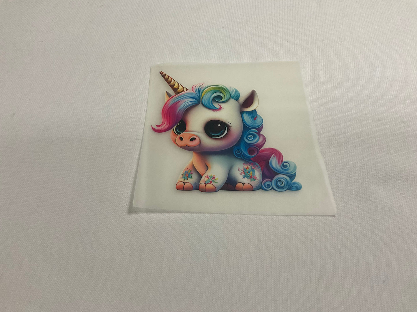 Bügelbild seitlich sitzendes Einhorn Weiß, Gold 8cm x 8cm (Breite x Höhe )